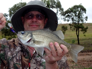 John Beath catches his first trophy Australian bass while fishing Lake St. Clair in New South Wales Australia.